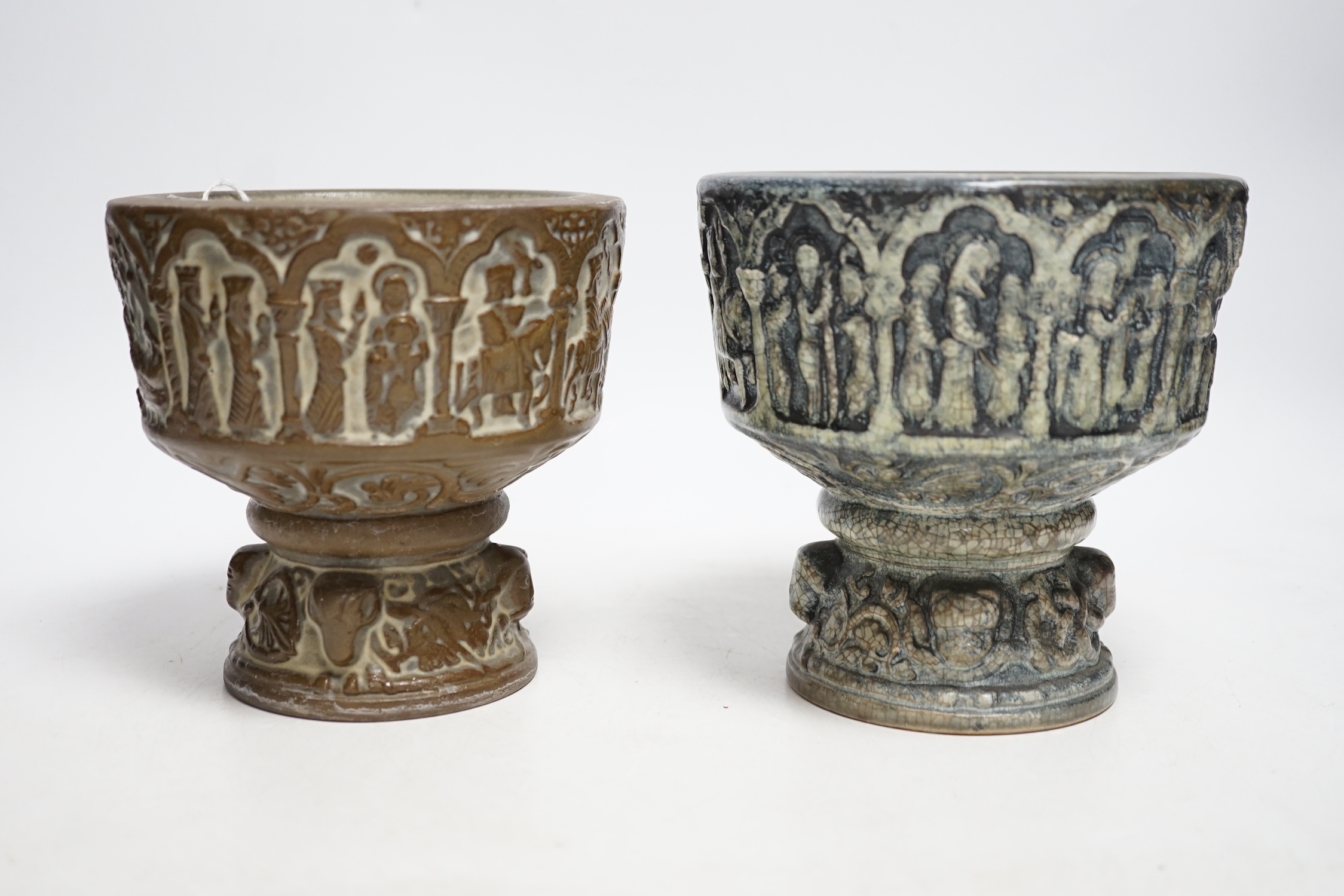 Two Michael Andersen & Sons, Denmark miniature stoneware fonts, one with label to the base; MA&S, both with the same impressed design of the life of Christ, tallest 14.5cm